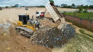 Big Filling up huge land, Bulldozer SHANTUI DH17C2 pushing stones, Dump truck 25.5T unloading