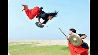 Two women engaged in Kalari fight