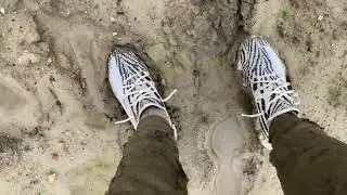 Rolling in mud with grey nike tech fleece and white yeezy zebra