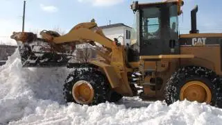 Cat 938G Wheel Loader Piling Snow