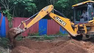 Jcb 3dx digging soil and preparing land for cultivation of tapioca