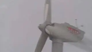 Wind turbine spins with ice