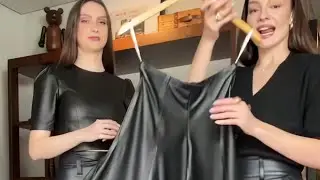 Designer and model try on leather
