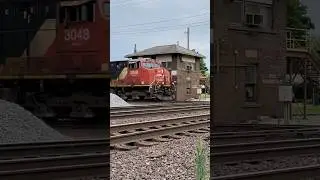 CN 3048 & CN 3951 pulling a manifest with J.B Tower Behind.