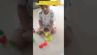 cute baby making breakfast with fruits