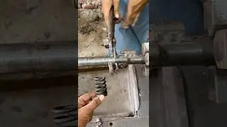 &ldquo;Skilled Craftsman Making a Strong Metal Spring by Hand&rdquo;
