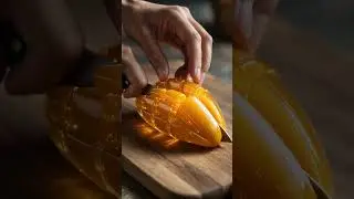 Slicing a Glowing Glass Mango Sculpture