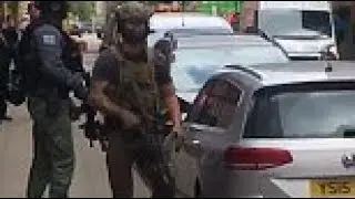 Armed police and soldiers raid Manchester city centre flat after Arena attack