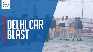 Forensics and police survey scene morning after blast near Delhi's Red Fort