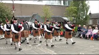 Comrie Pipe Band march off in St James Square Crieff during build up to 2023 Crieff Highland Games