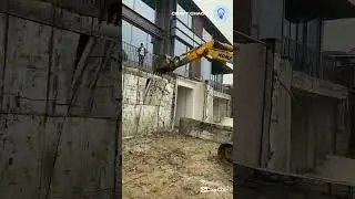 The process of excavator demolition building walls