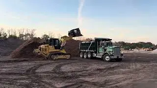 Cat 963 loading some reground mulch in a cold morning. 