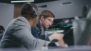 Mixed race stock traders talk and monitor real-time stocks data
