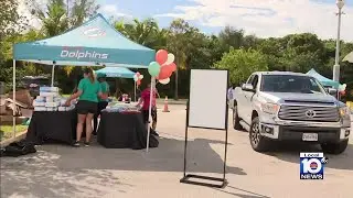 Dolphins hold drive-thru baby shower for veteran mothers