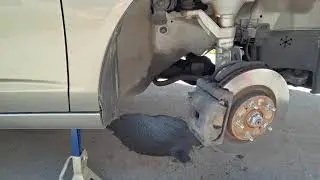 Checking brake pads on a 2003 Acura RSX