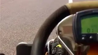Rotax fr125 max seniors kart driving at truck stop first person view.