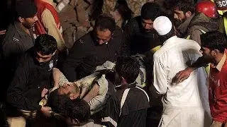 At least 16 dead and dozens trapped in Pakistan factory collapse