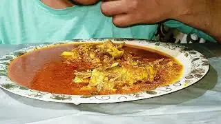 Eating fish curry 