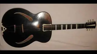 A VINTAGE ARCHTOP HOLLOW BODY GUITAR