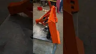 Minnesota Implement custom trailer receiver plate with trenching tool and accessories.