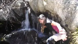 Dunking head in a waterfall
