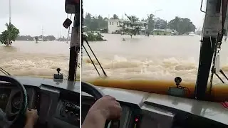 Bus Drives Through Flooded Road After Typhoon Nakri