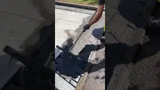 the process of leveling cement on paving in the yard to fill the gaps between paving stones #shorts