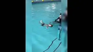 baby swim lessons thrown in pool #shorts 1