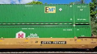 CN 2222, 5613 haul  Westbound intermodal container in well car freight train past Vicksburg, MI