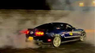 Ford mustang does donuts while passanger rows the boat and gets sick!