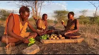 hadzabe people are eating bush and enjoy their meal