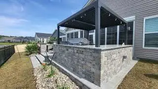 Outdoor Kitchen, Pergola, Lighting, Hardscape Design, and Outdoor Fire Pit in Myrtle Beach