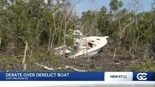 Abandoned boat lodged in mangroves near Fort Myers Beach sparks heated controversy