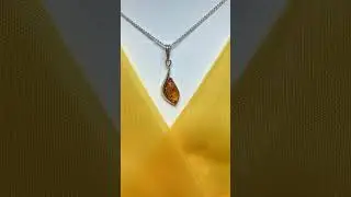 Sterling silver swirl real amber marquise shaped necklace