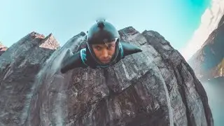 Wingsuit BASE jump over a waterfall | Immersive 360 VR