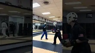 Doing karate drill sparring with kid 