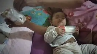 Baby drinking milk and play 
