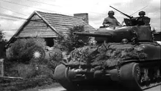 US Army 2nd Armored Division enters Canisy, France during World War II. HD Stock Footage