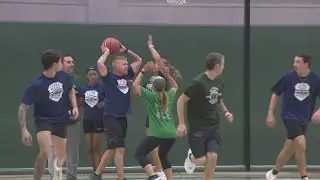 Police and educators face off in basketball game to help local families