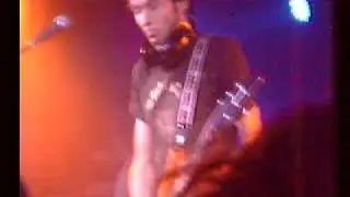 Paul Gilbert playing guitar with his teeth