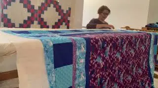 Putting the batting and Quilt top over the backing