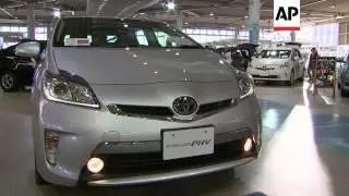 Toyota said Wednesday it is recalling 1.9 million hybrid Prius cars globally for a software glitch t