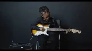 Prince Issa Plays Amazing Grace on the Guitar