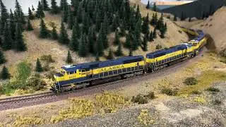 Custom Athearn Genesis Alaska Railroad SD70MAC's Haul Ballast Train!