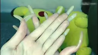 LONG NAILS OF A BEAUTIFUL SHAPE COATED WITH STRANGE POLISH