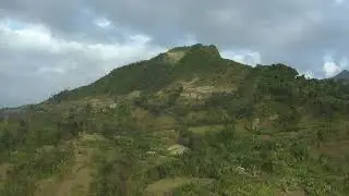 Aerial shot of a mountain covered with plantations, in Ethiopia / 4K Stock Footage
