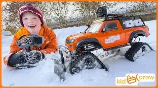 Remote controlled truck saves dad and plows snow with crawler tracks. Educational | Kid Crew