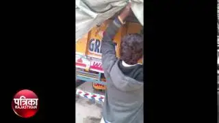 truck loaded with alcohol the police arrested the driver, kotputli