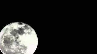UFO crossing the moon