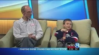 Tootoo gives young fan hockey stick